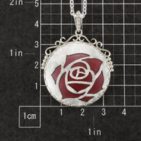 Sold Sale: Burgundy rose open work pendant with heat patinaed copper
