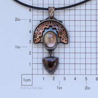 Quartz lined with Black Mother of Pearl Openwork Copper and oxidized silver Arch pendant featuring Eudialyte