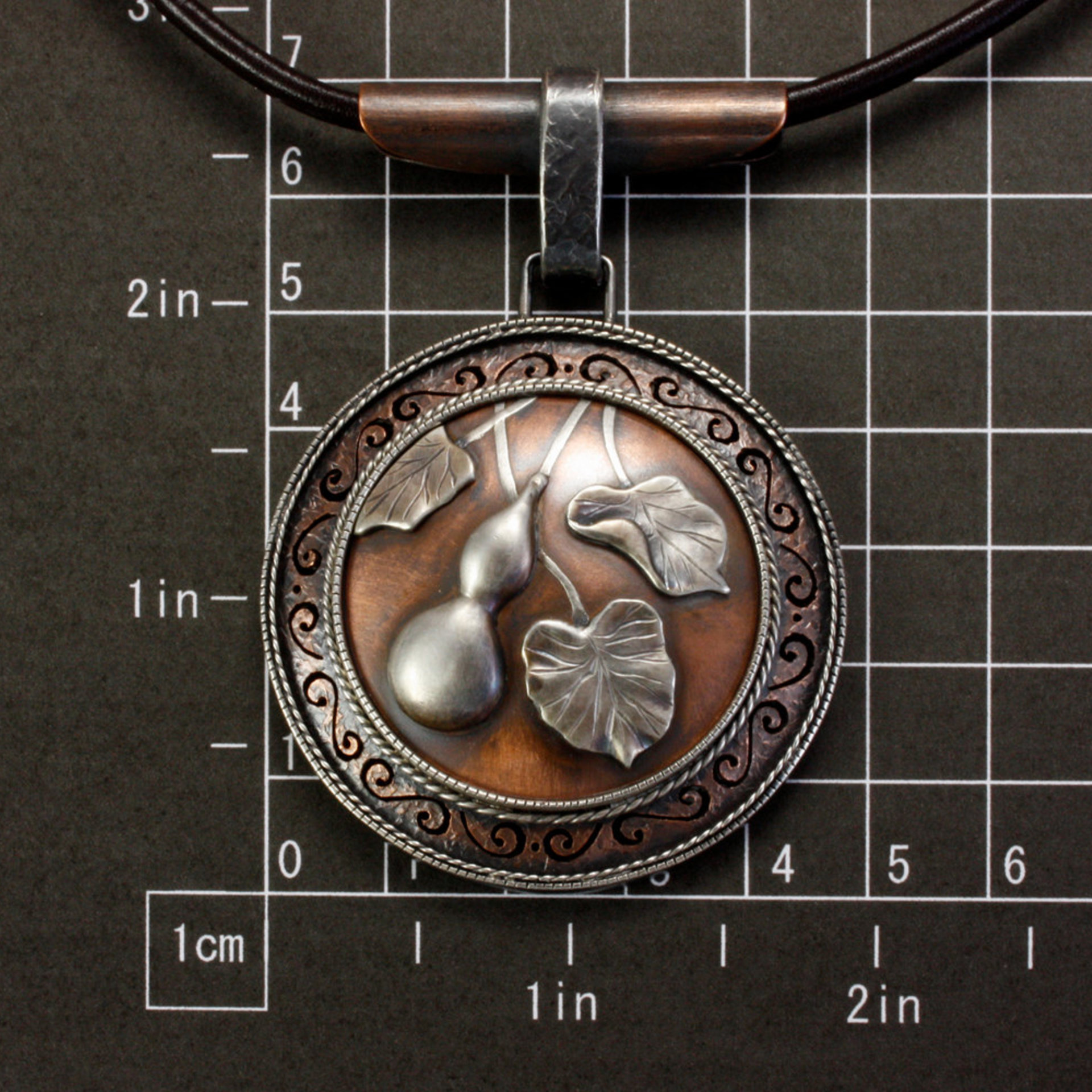 SOLD: Gourd motif silver and copper round picture pendant