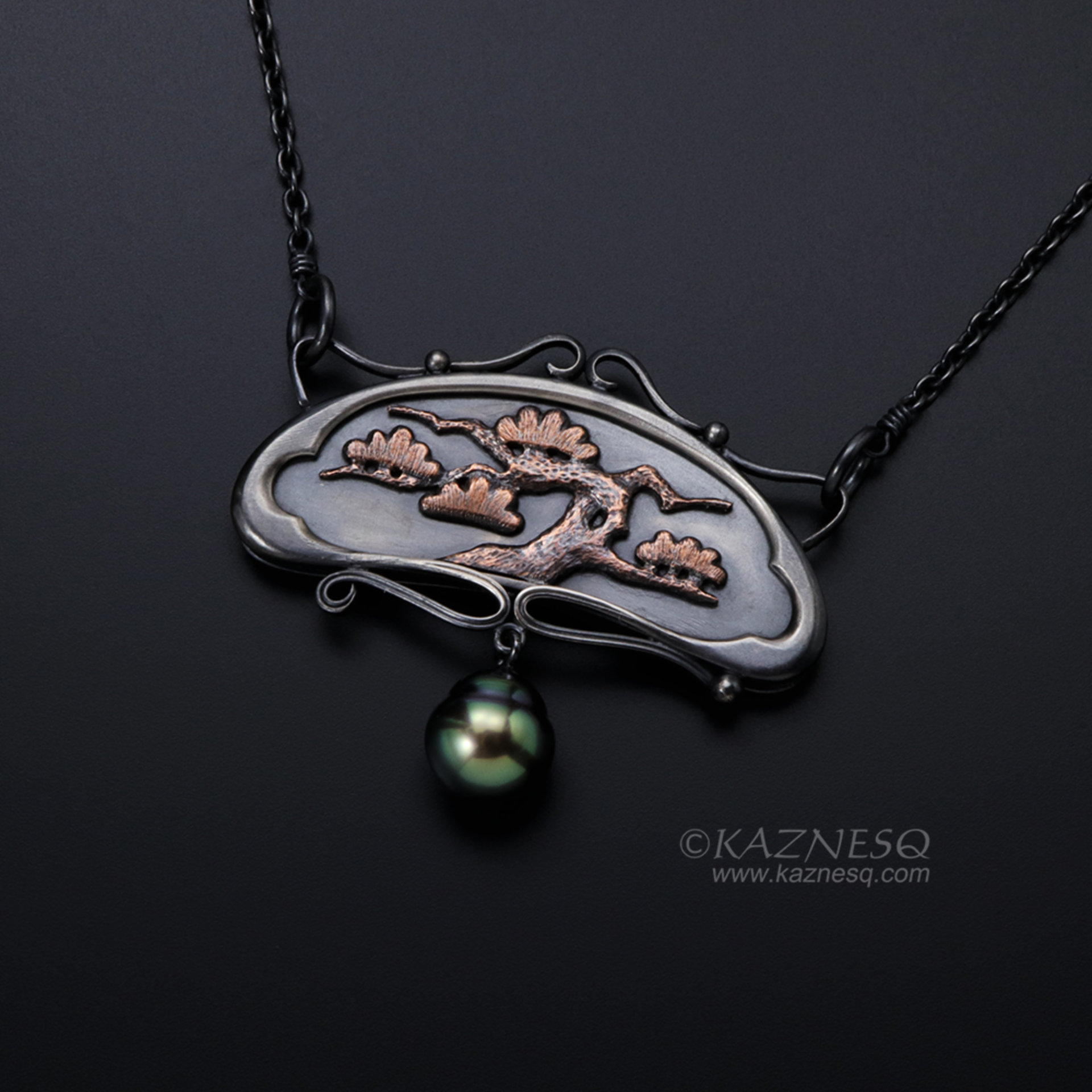 Art Nouveau style pine tree motif necklace with a black pearl