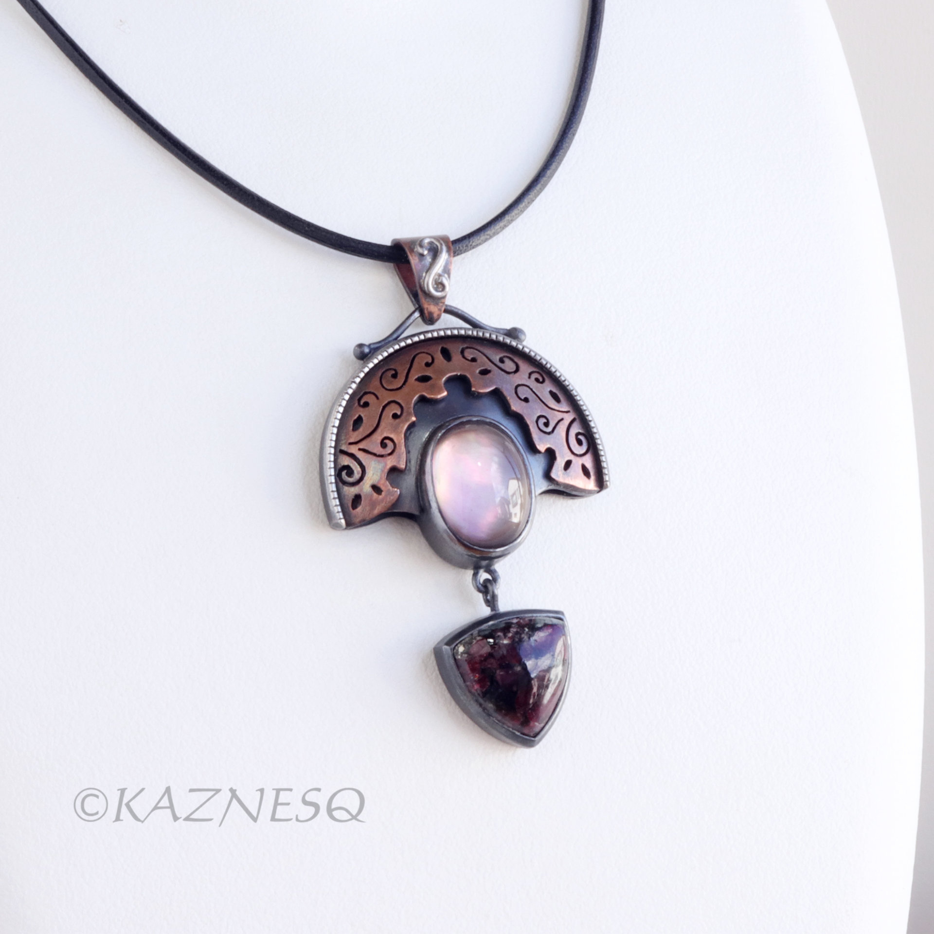 Quartz lined with Black Mother of Pearl Openwork Copper and oxidized silver Arch pendant featuring Eudialyte