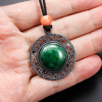 (C) KAZNESQ: Jadeite round oriental open work pendant