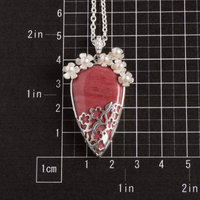 Lacy openwork silver pendant with piemontite.