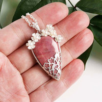 Lacy openwork silver pendant with piemontite.