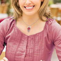 Lacy openwork silver pendant with piemontite.