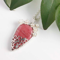 Lacy openwork silver pendant with piemontite.