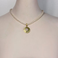 Gold silver round pendant with a pearl necklace