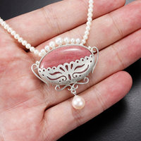 Pink stone oval silver pendant with pearls