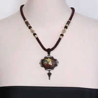 SOLD: Gold foil applied stone and Japanese patinaed sterling pendant