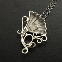 Purple spinel featured silver pendant of an imaginary flower