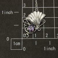 Purple spinel featured silver pendant of an imaginary flower