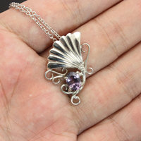 Purple spinel featured silver pendant of an imaginary flower
