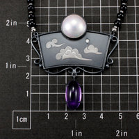 SOLD: The moon and the morning star necklace with a mabe, a diamond, and amethysts.