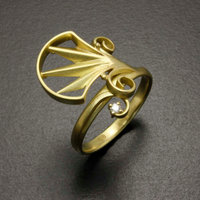 Arch and scroll 18K gold ring with a diamond