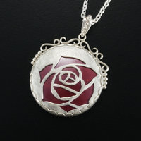 Sold Sale: Burgundy rose open work pendant with heat patinaed copper