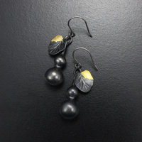 Gourd earrings of patinaed silver with fine gold leaf