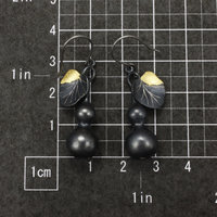 Sold: Gourd earrings of patinaed silver with fine gold leaf