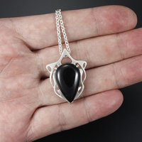This Art Nouveau style pendant necklace is made of a black tourmaline cab and st