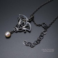 Lavender spinel Art Nouveau style oxidized silver pendant with a freshwater pear