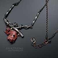 Withered copper grape leaf with Japanese patina and oxidized silver necklace .