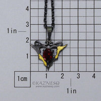 Goth taste silver pendant necklace with oval garnet and gold leaf