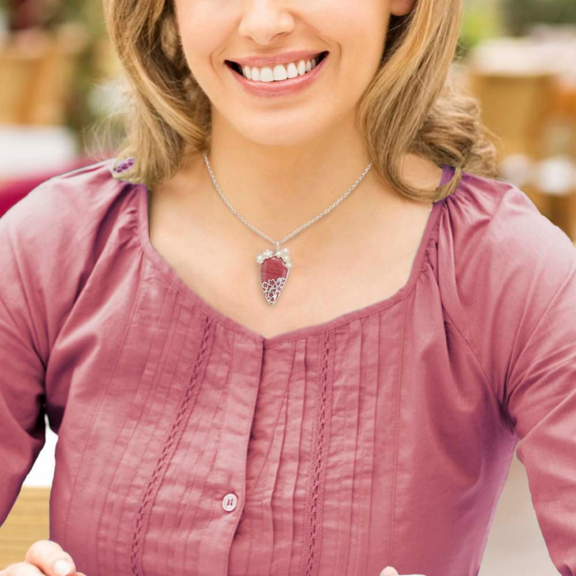 Lacy openwork silver pendant with piemontite.