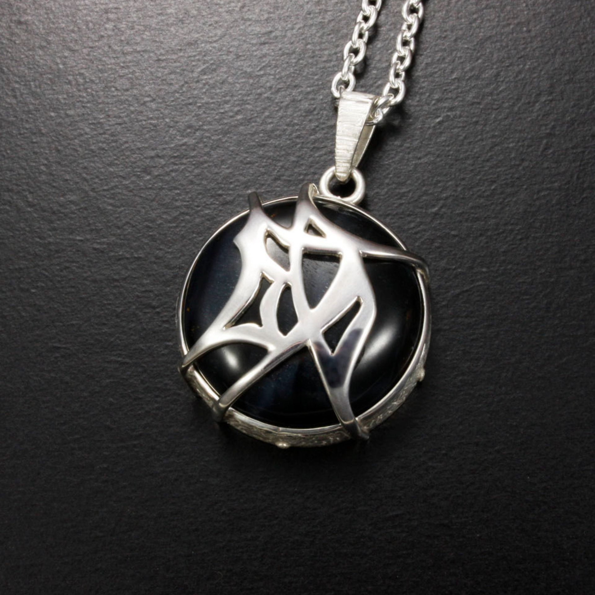 SOLD: Tribal design Chinese character"Accomplishment" silver pendant with a Hawk's Eye