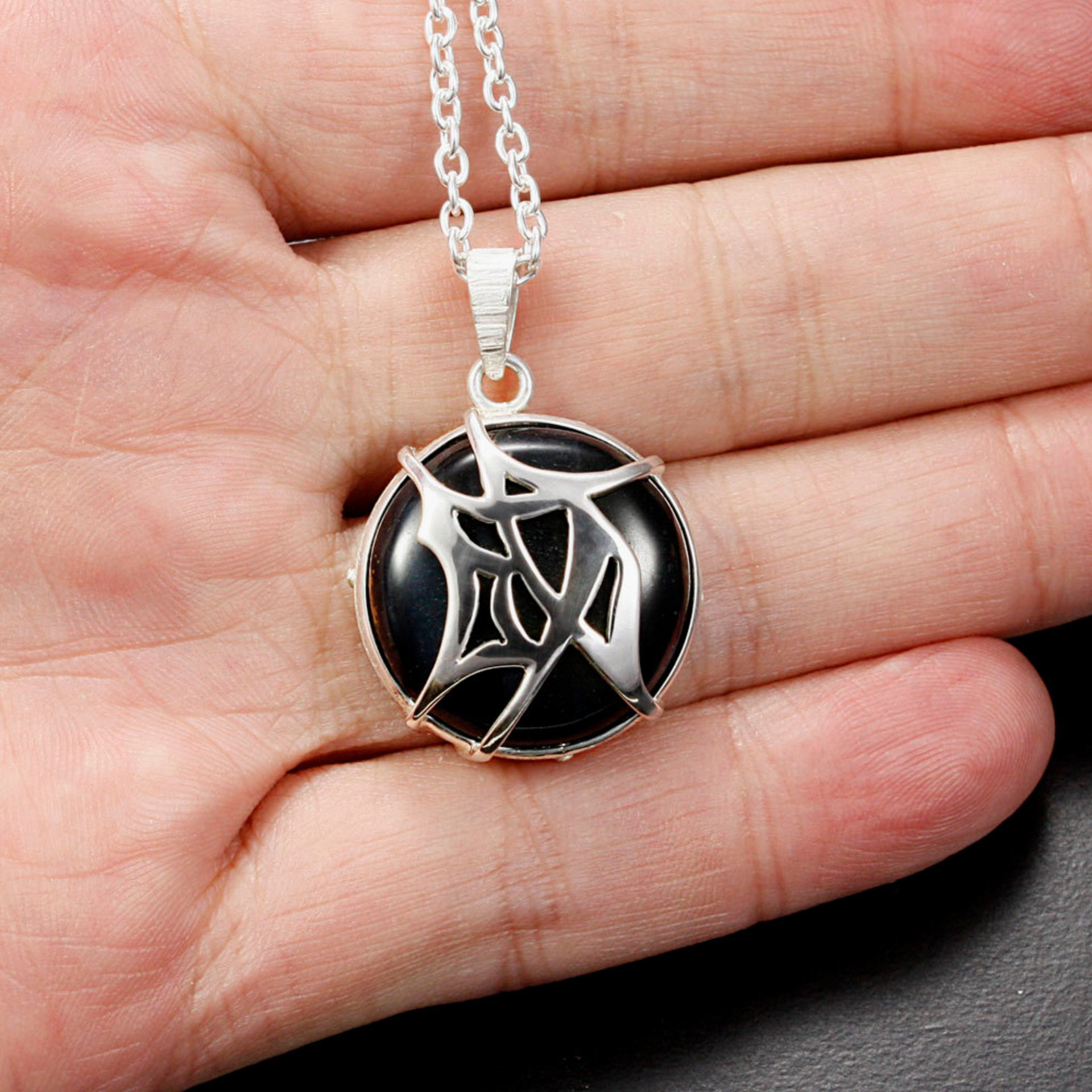 SOLD: Tribal design Chinese character"Accomplishment" silver pendant with a Hawk's Eye