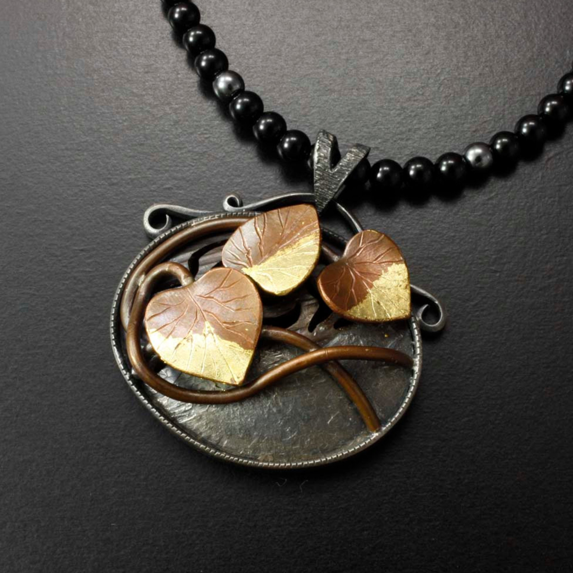 Copper leaf oval pendant