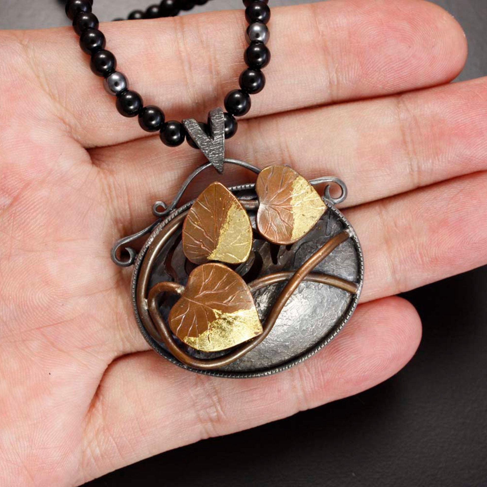 Copper leaf oval pendant