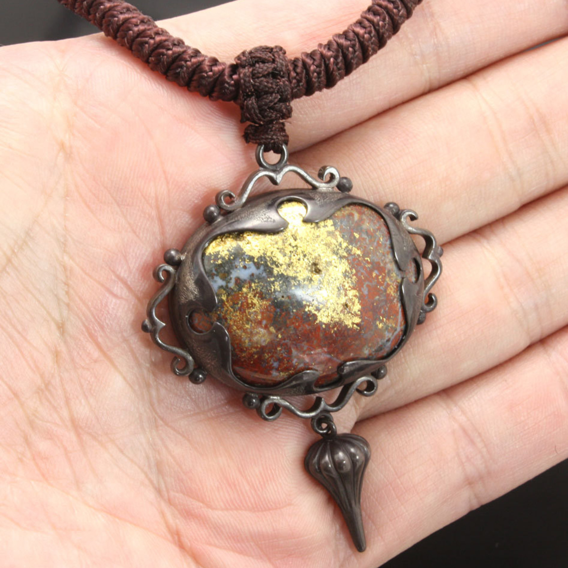 SOLD: Gold foil applied stone and Japanese patinaed sterling pendant