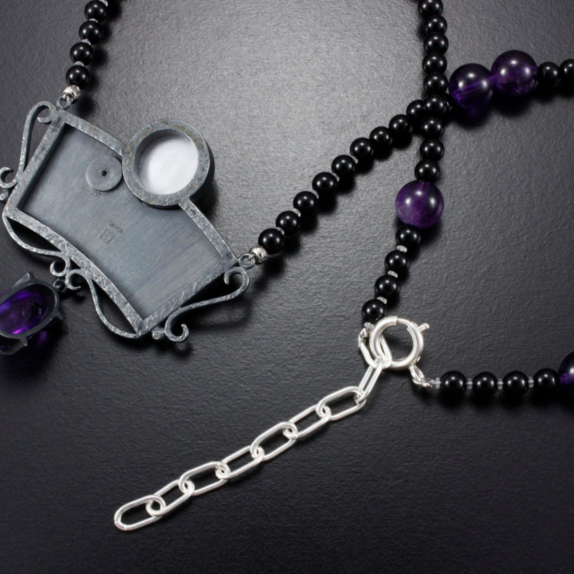 SOLD: The moon and the morning star necklace with a mabe, a diamond, and amethysts.