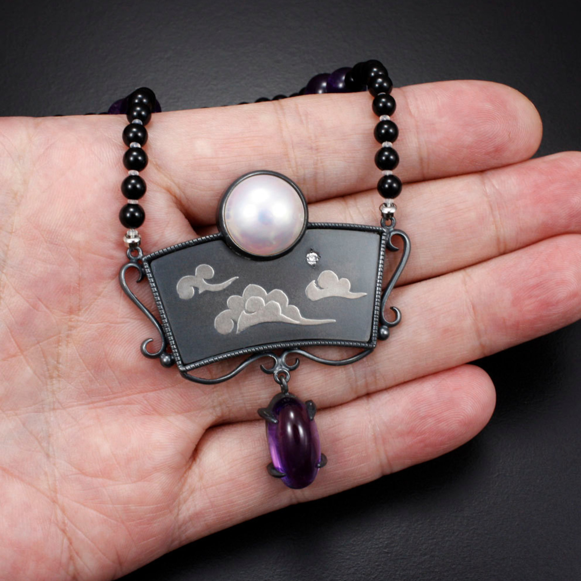 SOLD: The moon and the morning star necklace with a mabe, a diamond, and amethysts.