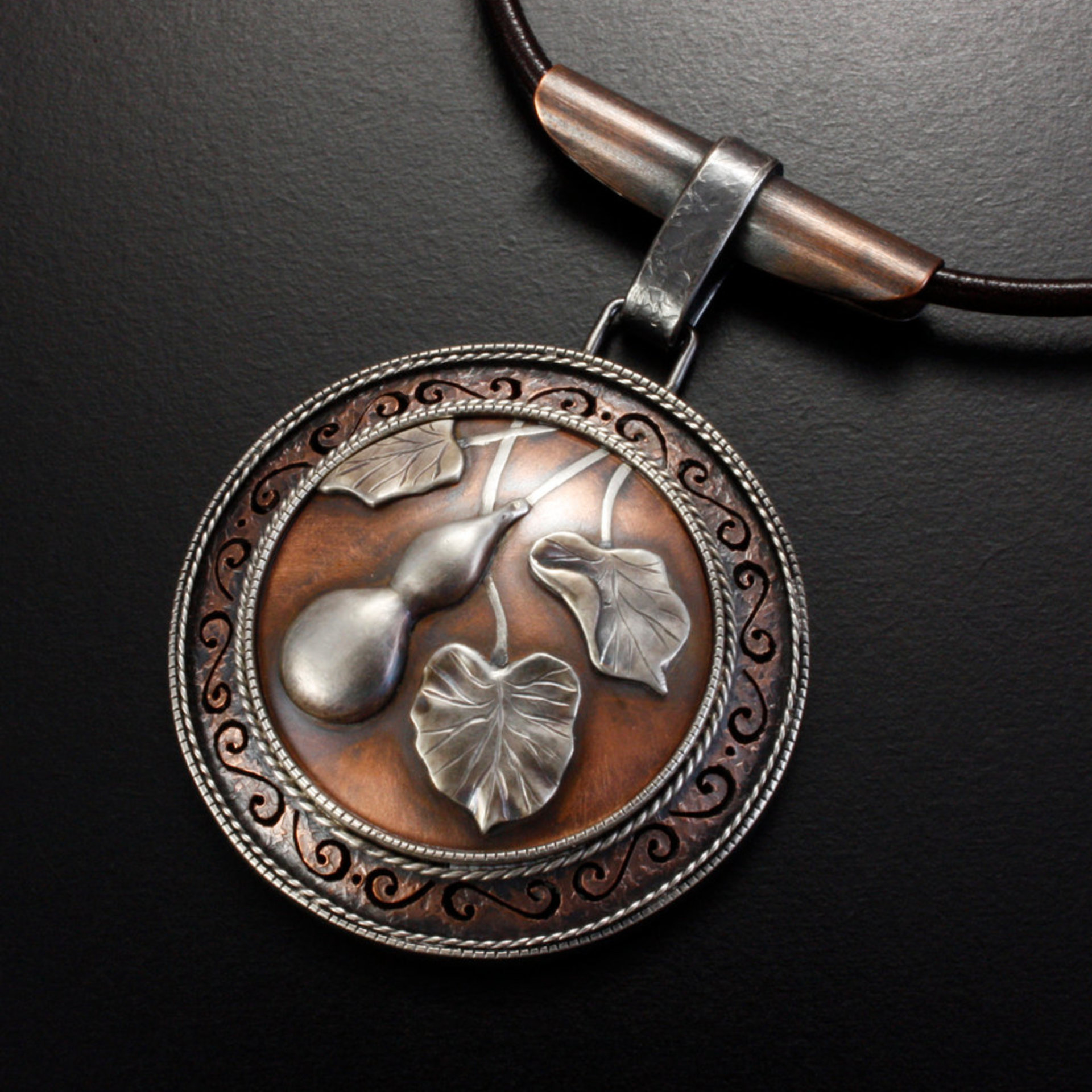 SOLD: Gourd motif silver and copper round picture pendant