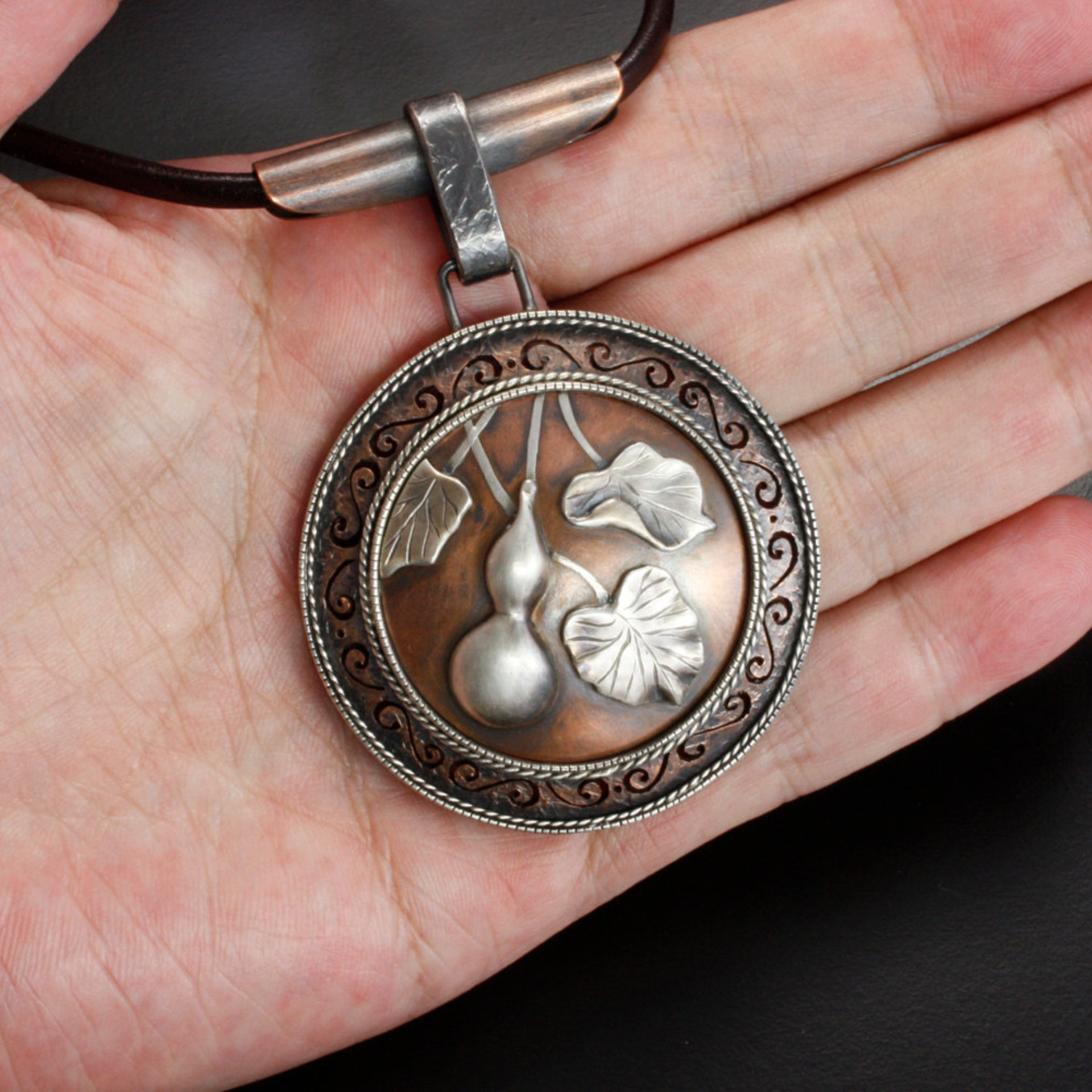 SOLD: Gourd motif silver and copper round picture pendant