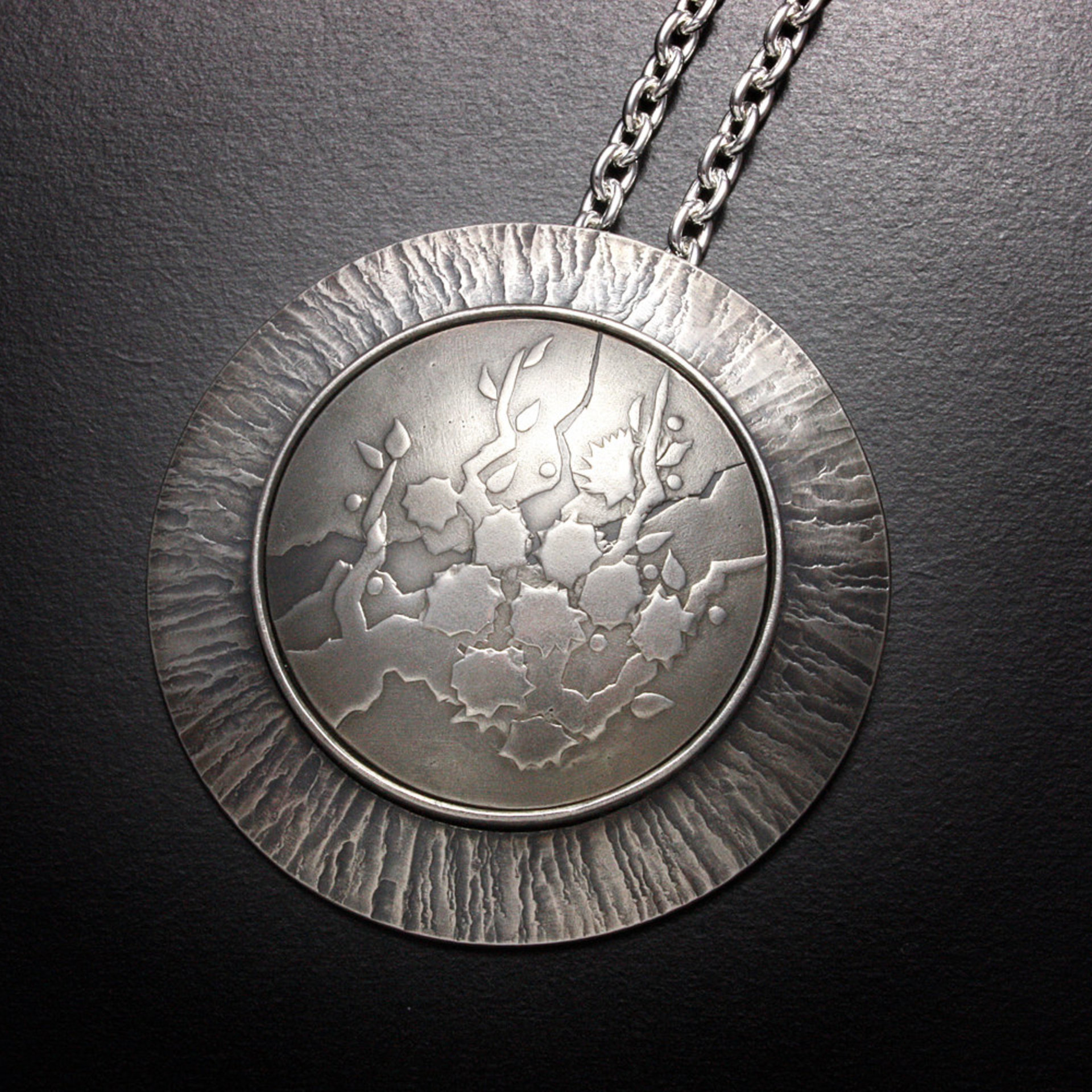 SOLD: Round Keum Boo silver pendant of white blossoms motif