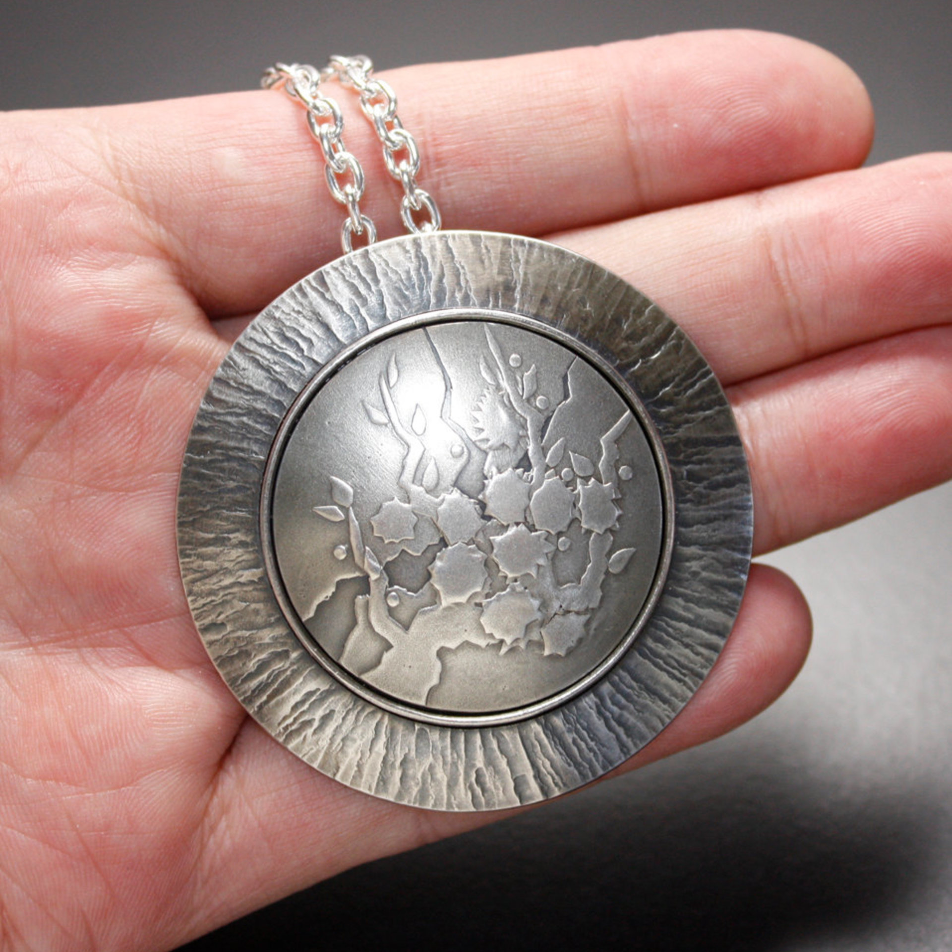 SOLD: Round Keum Boo silver pendant of white blossoms motif