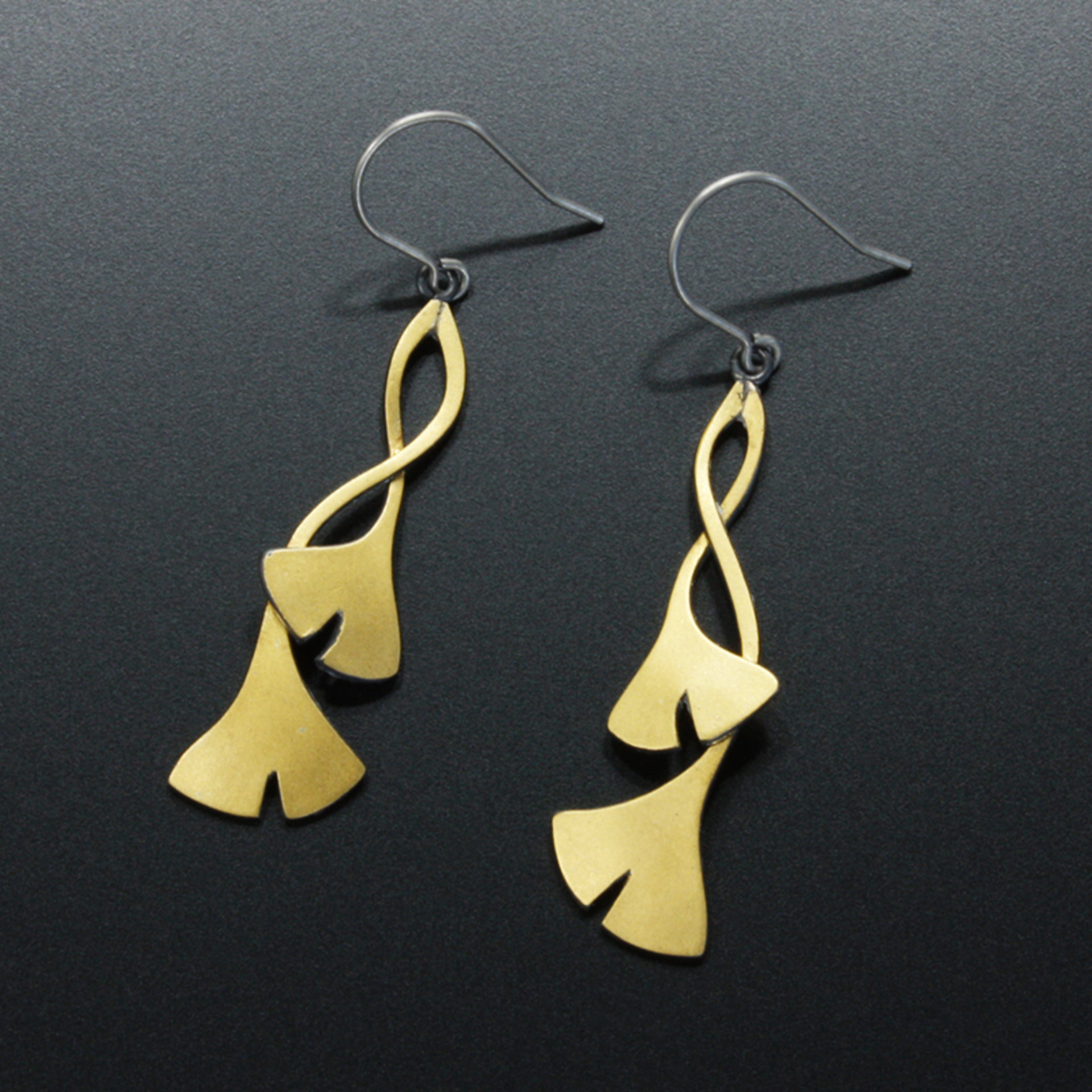 Intertwined ginkgo leaves made of oxidized sterling silver and fine gold foil
