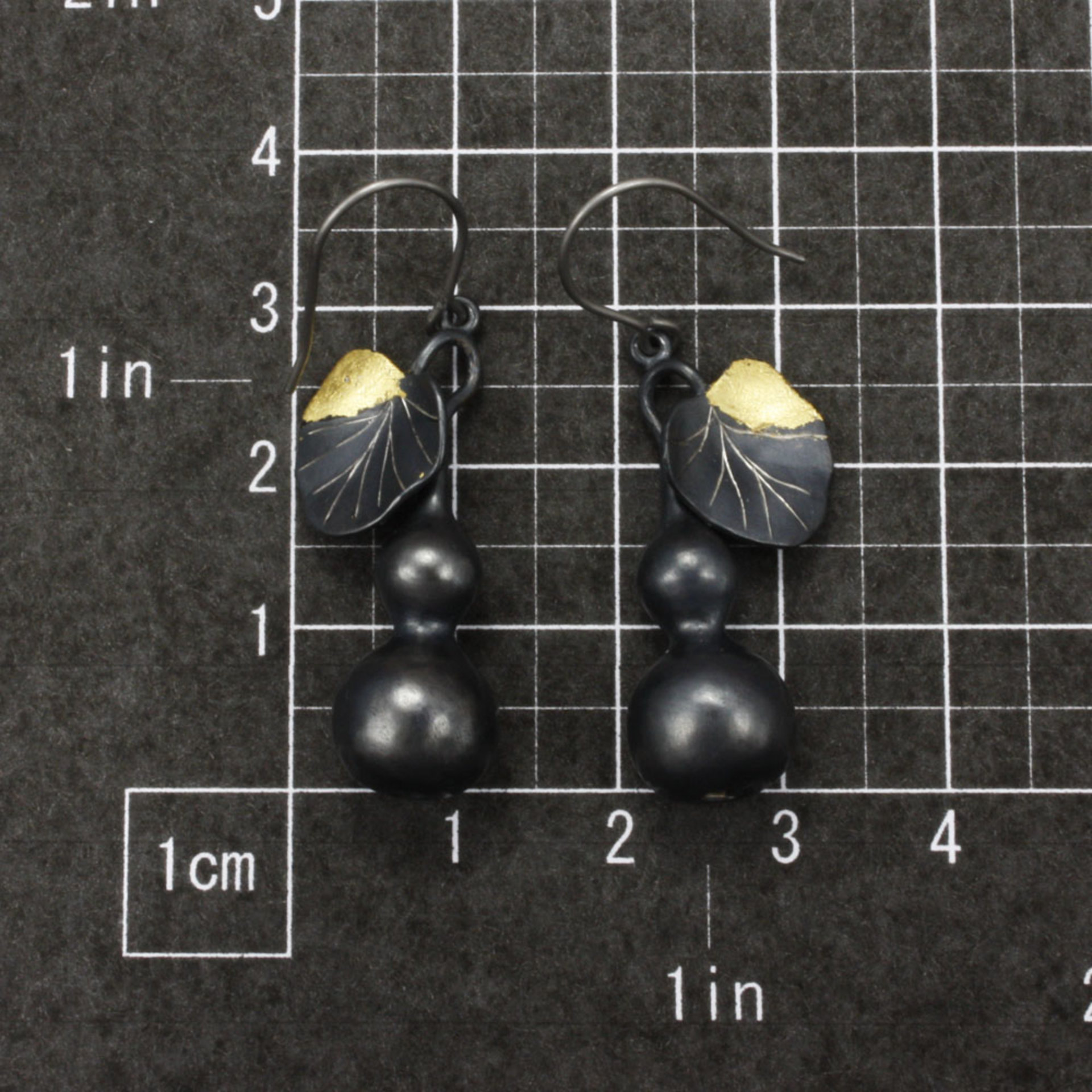 Sold: Gourd earrings of patinaed silver with fine gold leaf