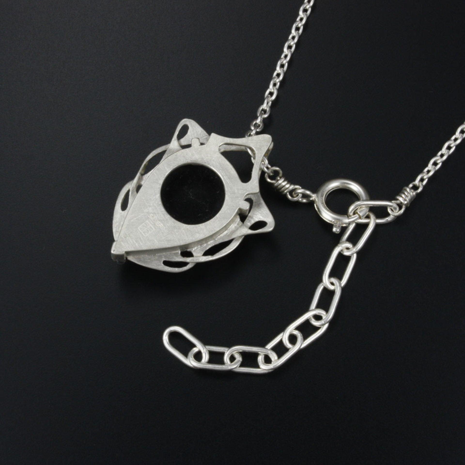 This Art Nouveau style pendant necklace is made of a black tourmaline cab and st