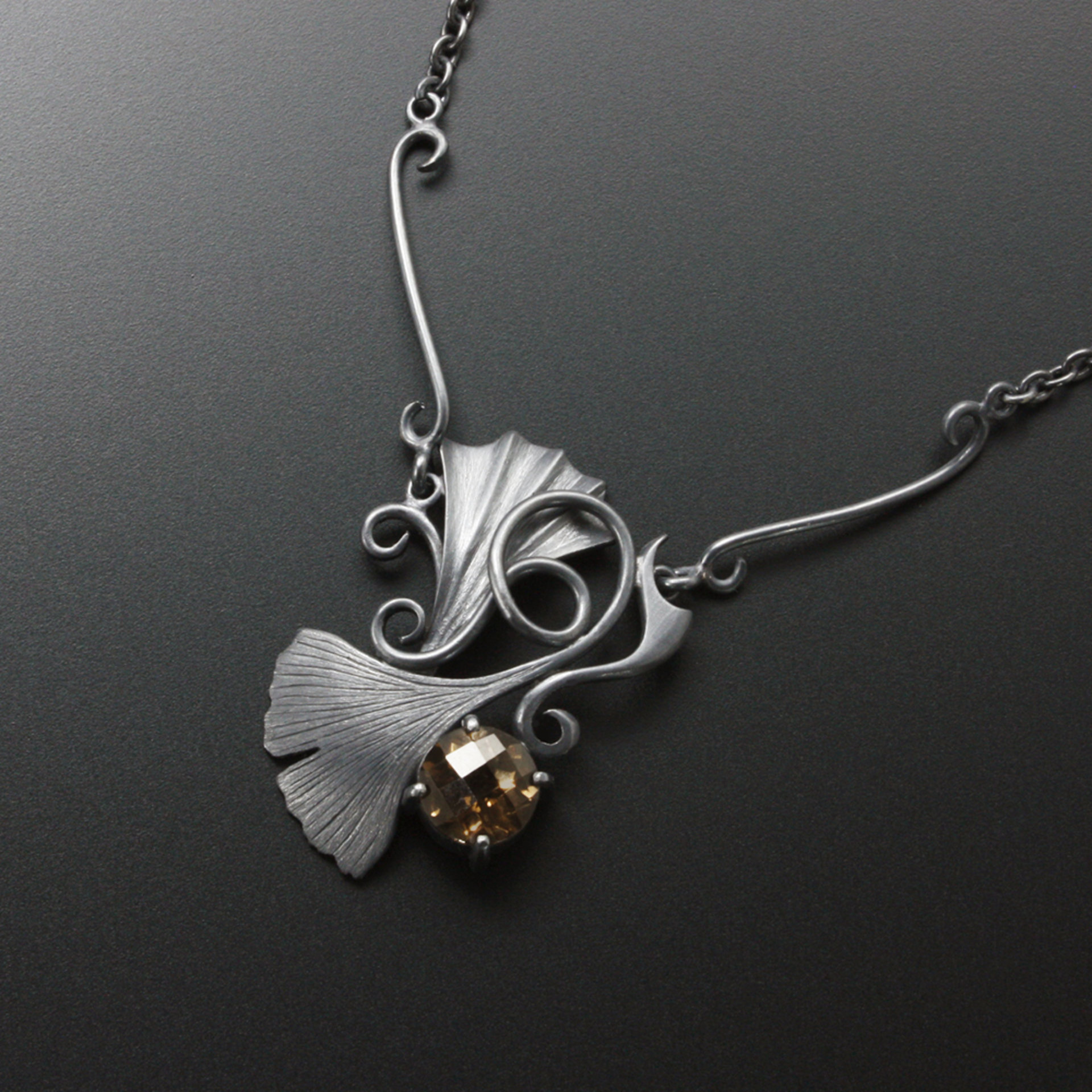 Gothic style Ginkgo necklace of oxidized silver and brown quartz