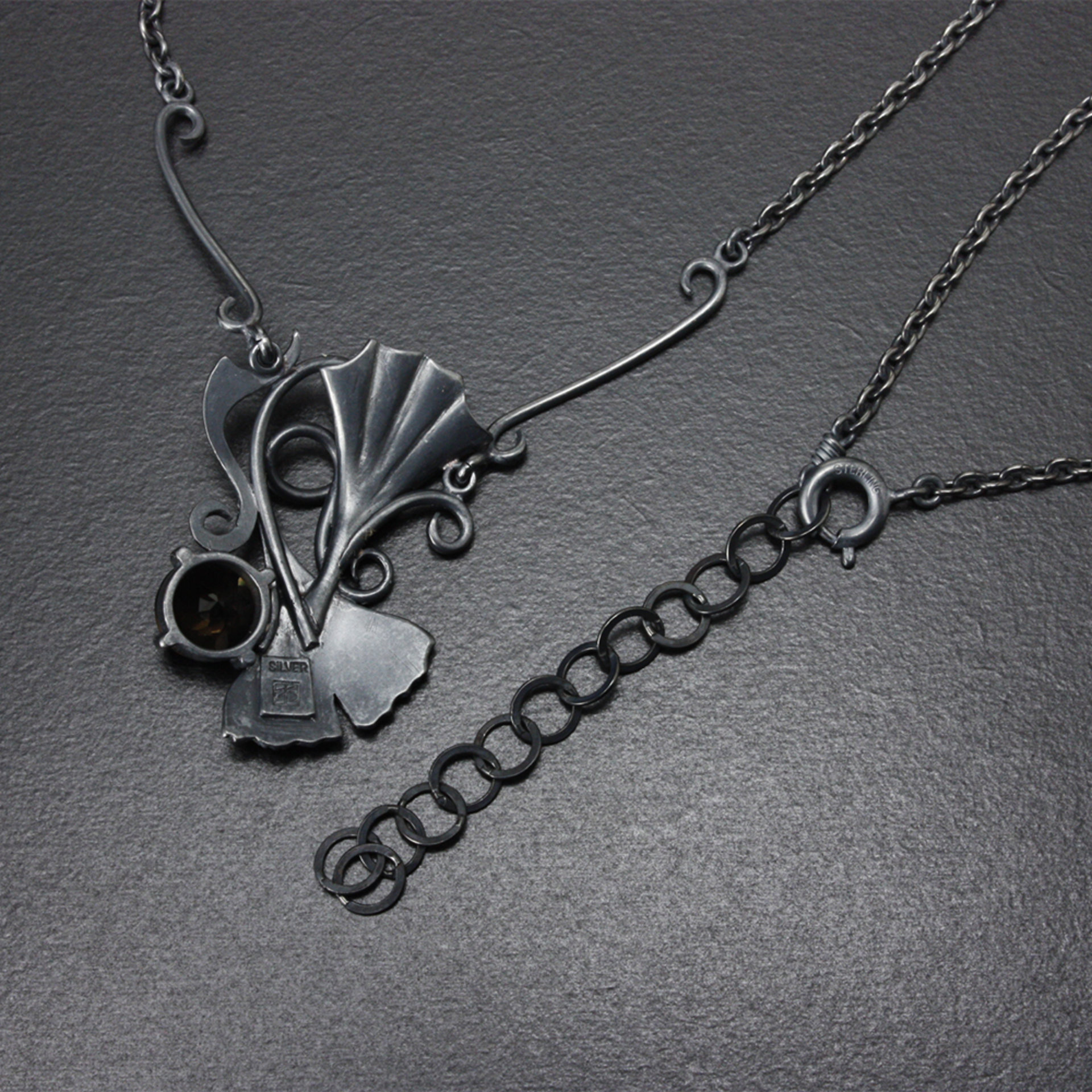 Gothic style Ginkgo necklace of oxidized silver and brown quartz