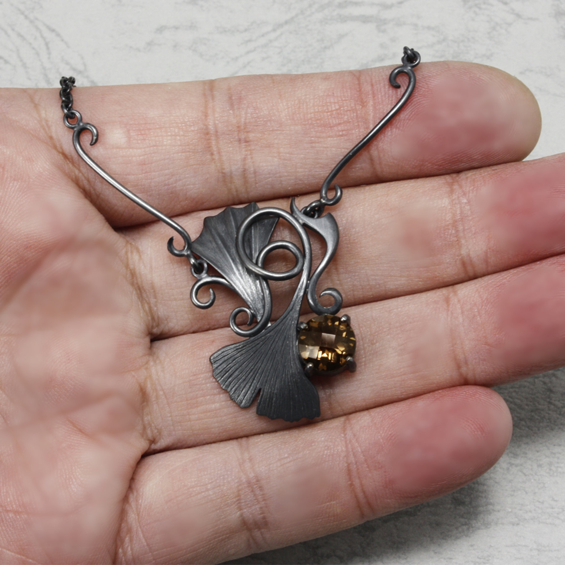 Gothic style Ginkgo necklace of oxidized silver and brown quartz