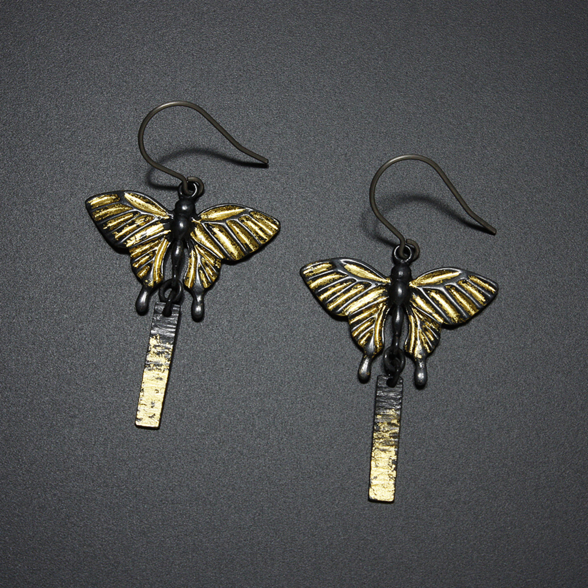 Oxidized silver butterfly earrings with fine gold leaf