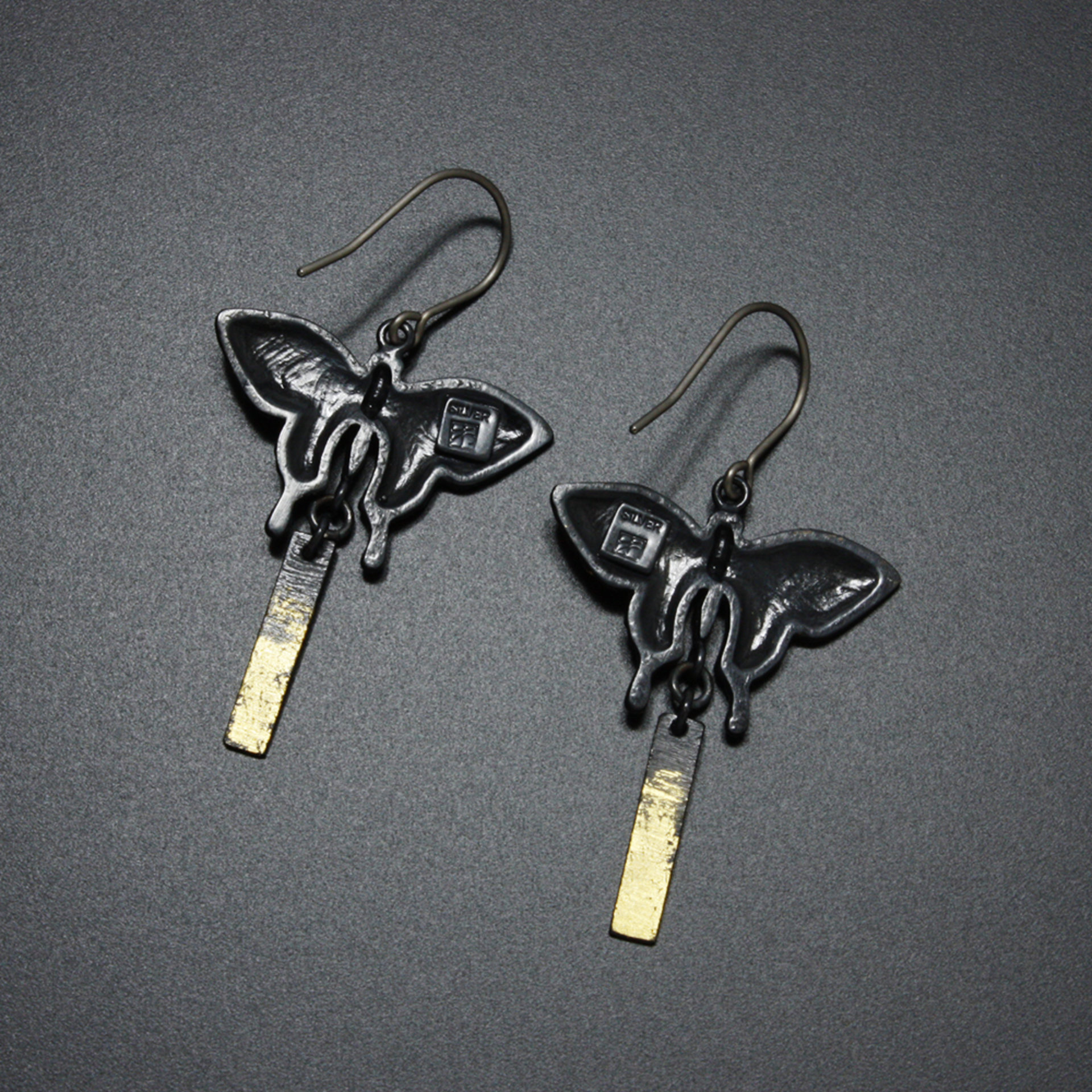 Oxidized silver butterfly earrings with fine gold leaf