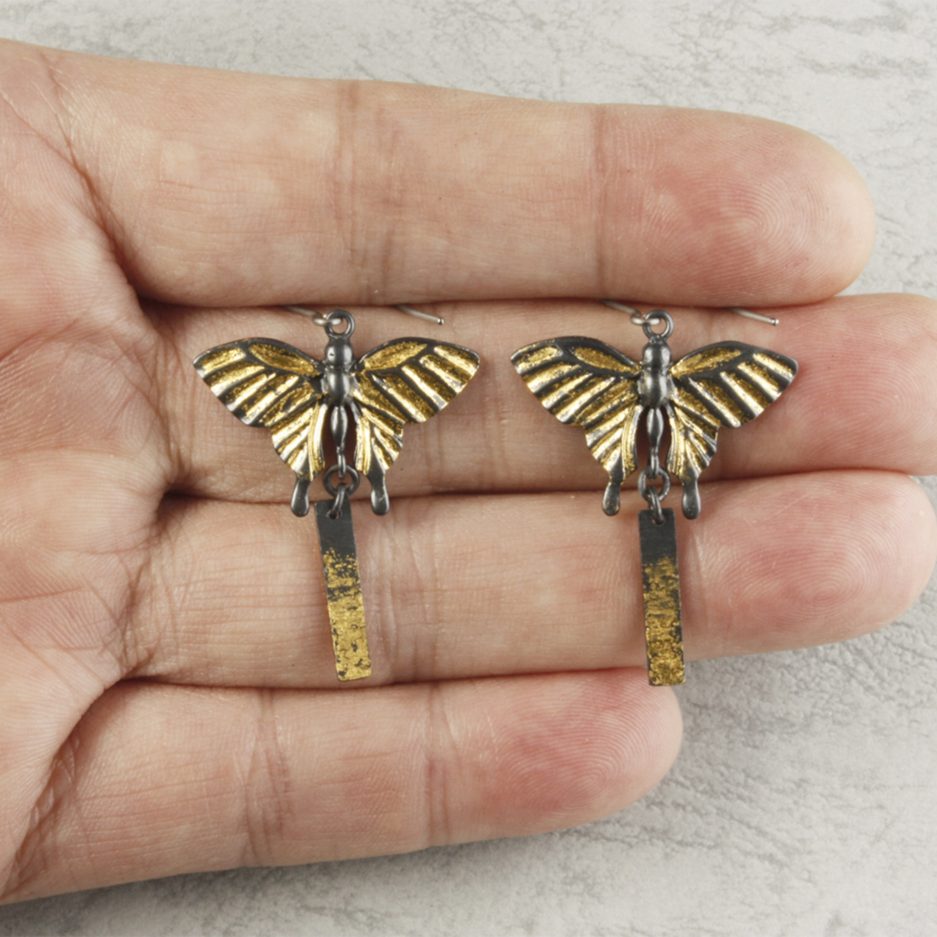 Oxidized silver butterfly earrings with fine gold leaf