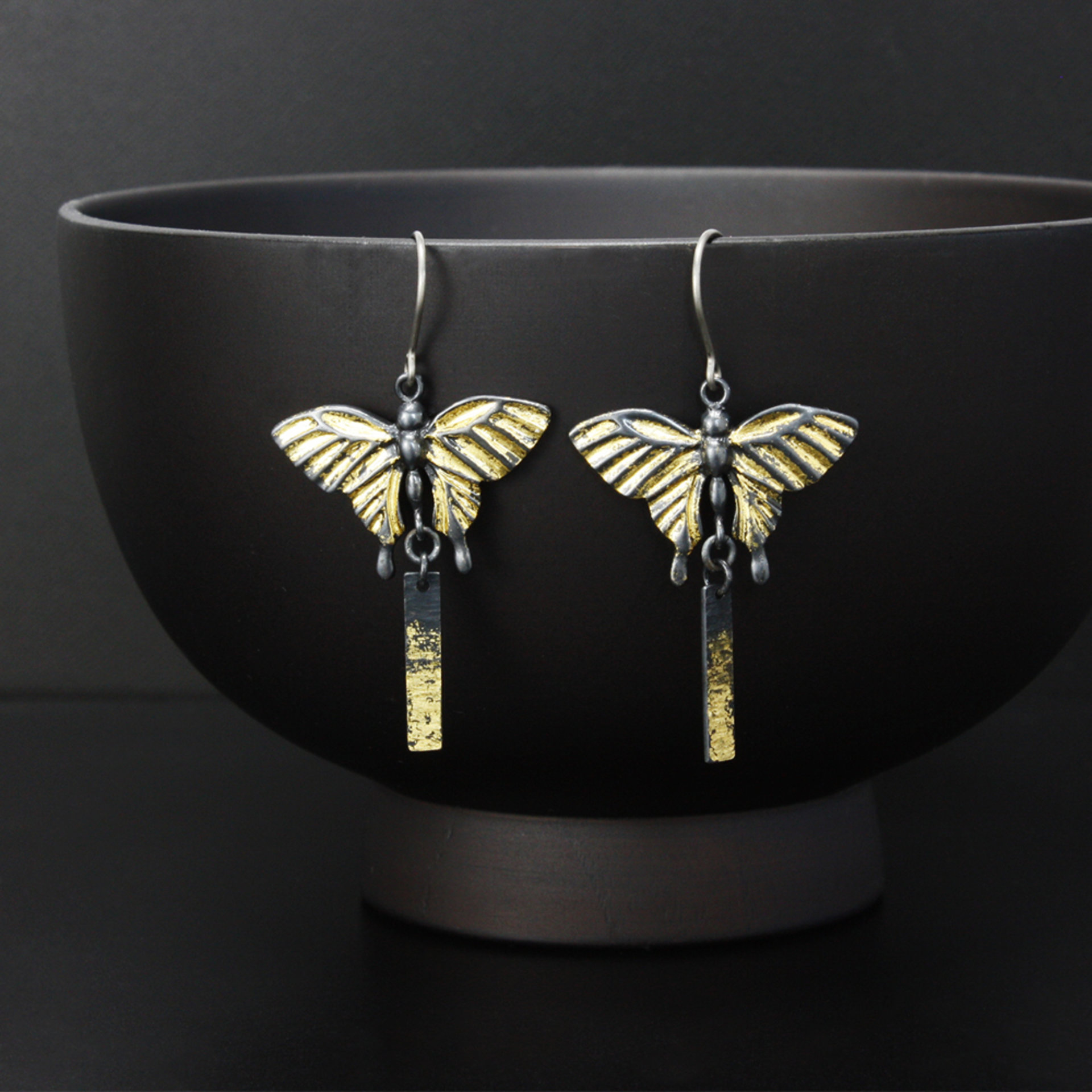 Oxidized silver butterfly earrings with fine gold leaf