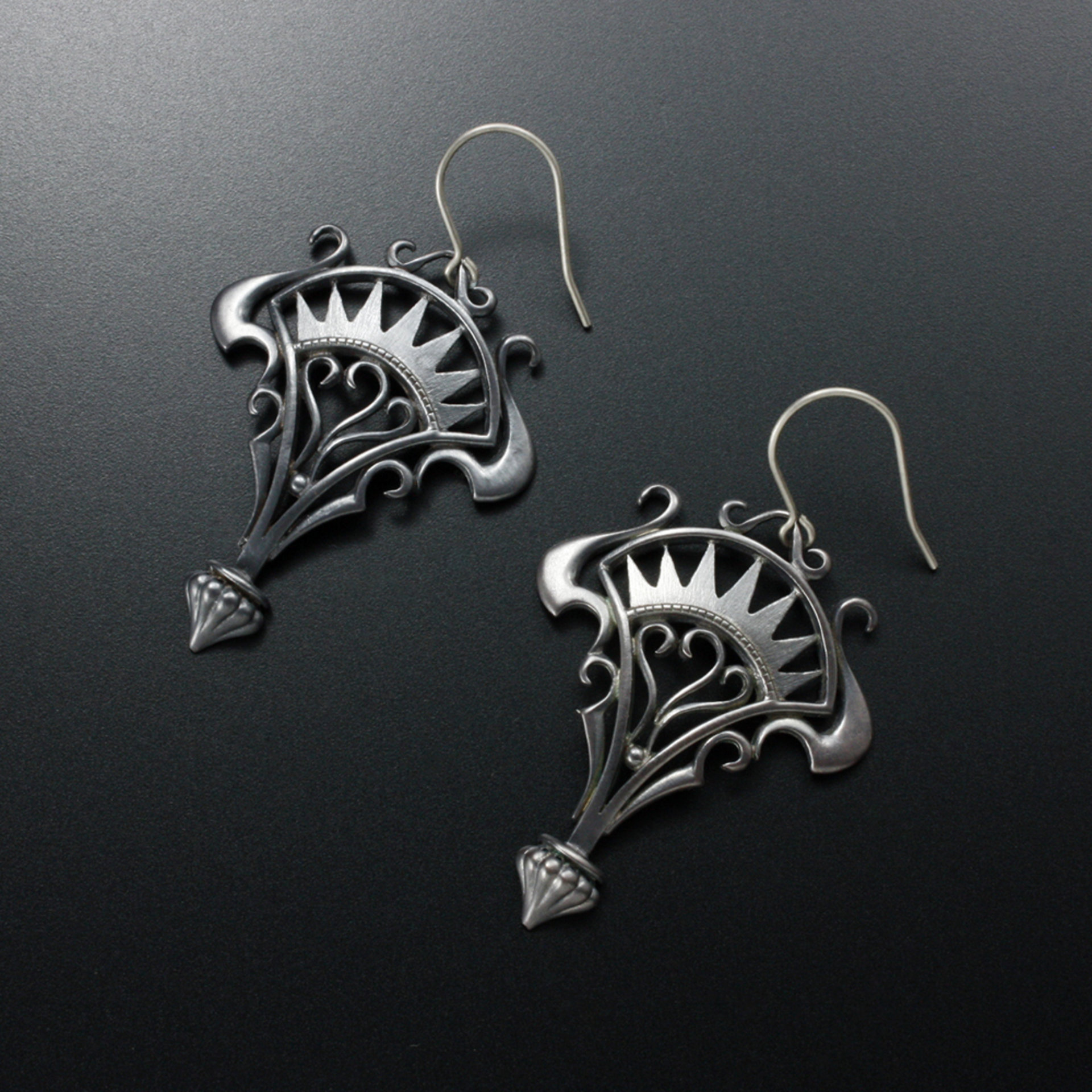 Oxidizes silver arch and scrolls earrings