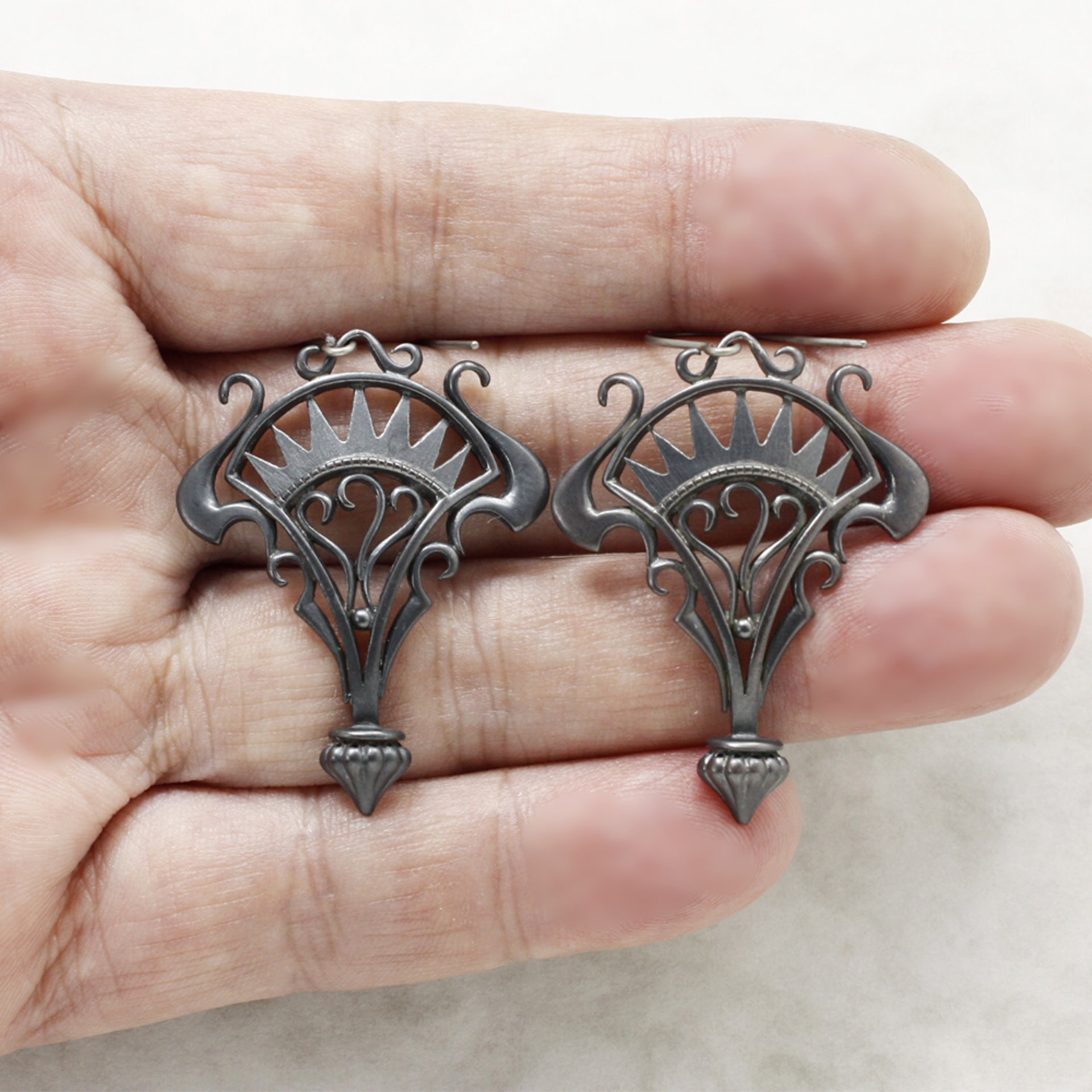 Oxidizes silver arch and scrolls earrings