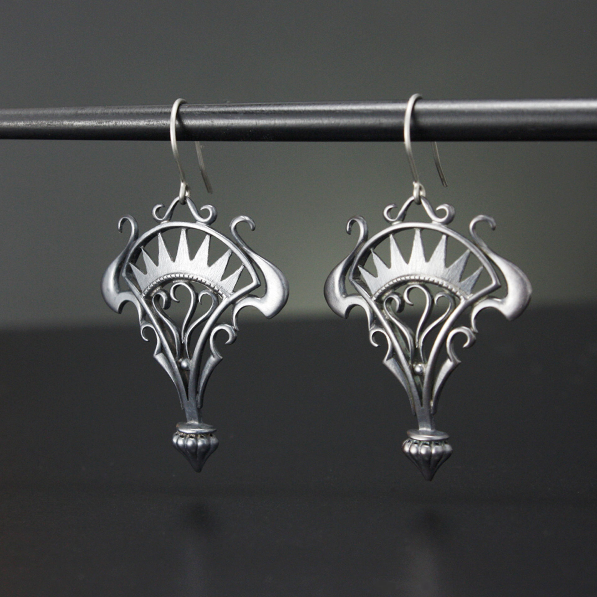 Oxidizes silver arch and scrolls earrings